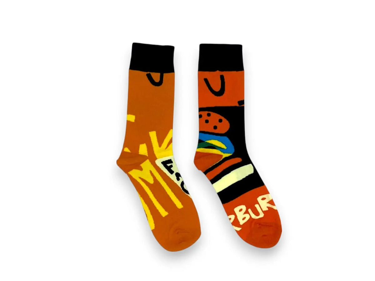 Flat lay of orange and black fish-and-chips and burger novelty socks