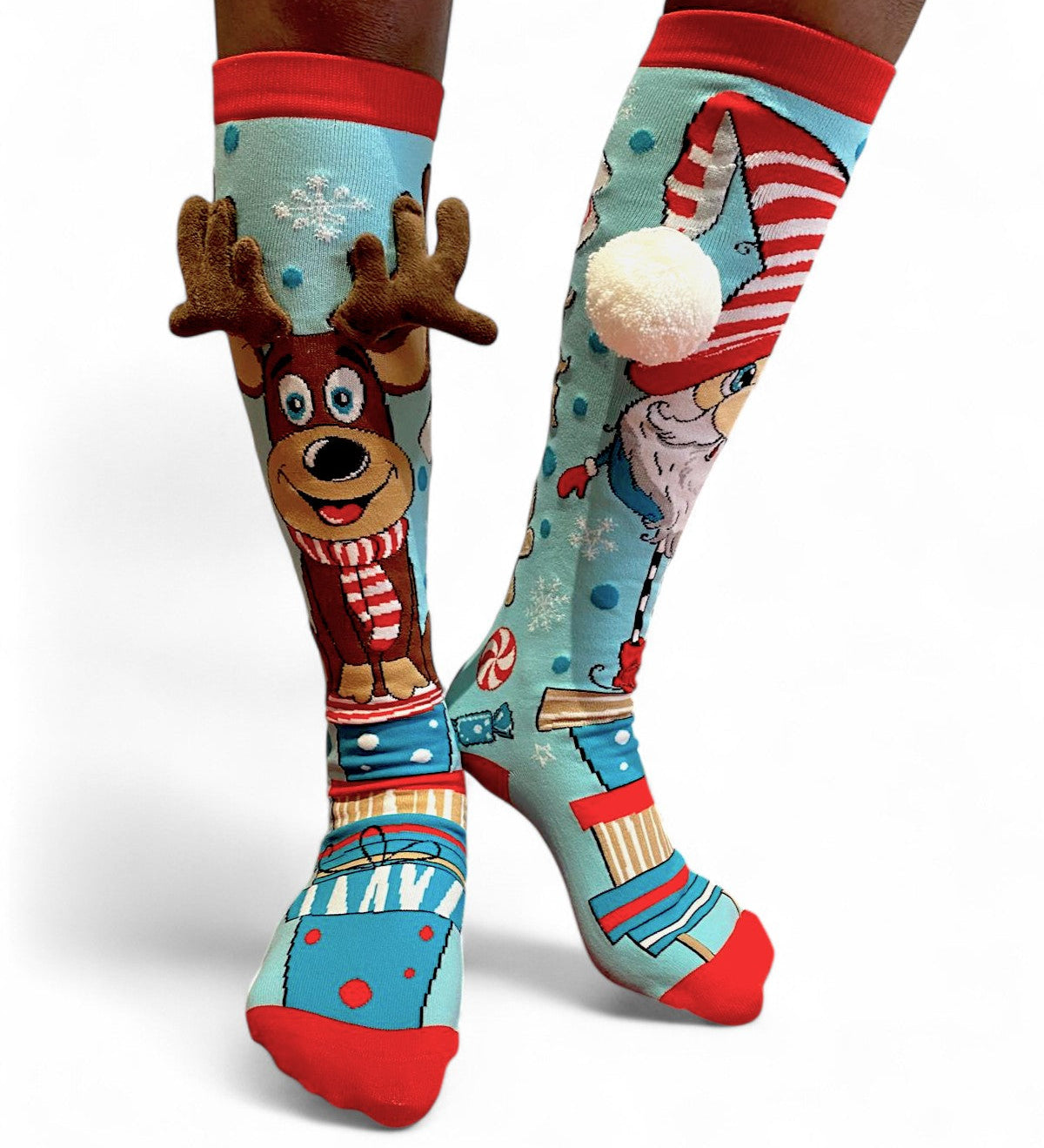 Light-blue mismatched Christmas knee socks with a reindeer with plush antlers and a Santa with a pom-pom