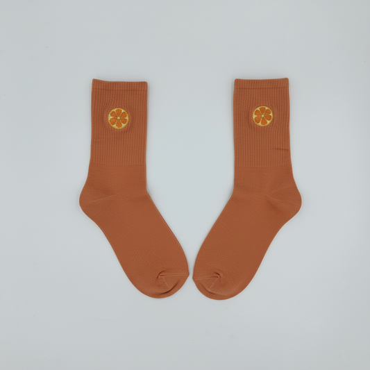 Studio quality product shot of terracotta citrus socks on white background
