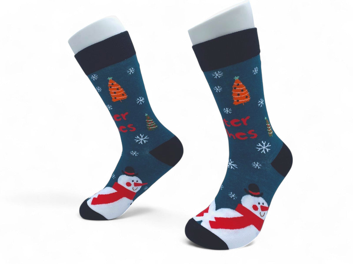 Side view of dark teal snowman Christmas crew socks with snowflakes and small trees