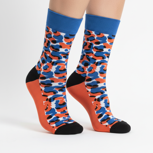 Angled professional product photo of camouflage-patterned socks