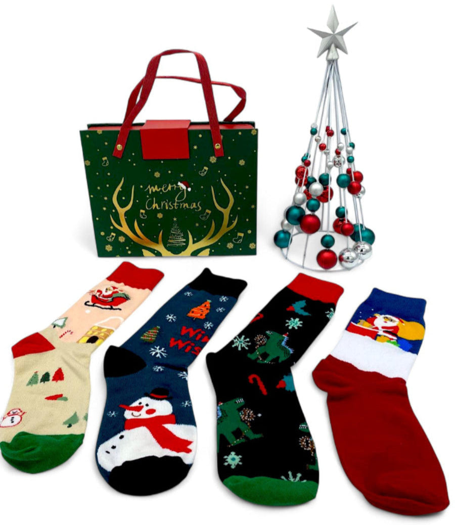 Christmas Socks Gift Box with four pairs of character socks: Santa, a snowman and dinosaurs in Santa hats